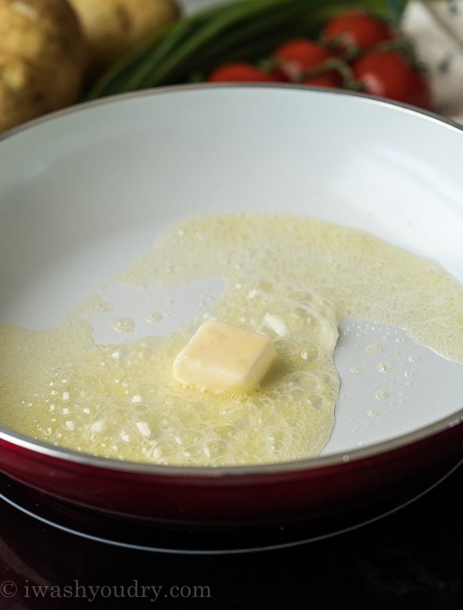 Add butter to the pan and let it melt and get bubbly before adding your scrambled eggs.