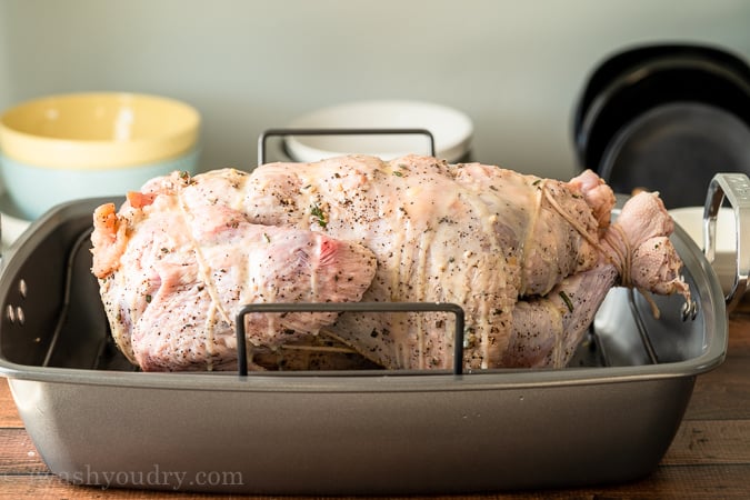 Drizzle melted butter all over the turkey, turn breast-side down and roast.