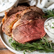 Perfectly cooked Standing Rib Roast with creamy horseradish sauce!