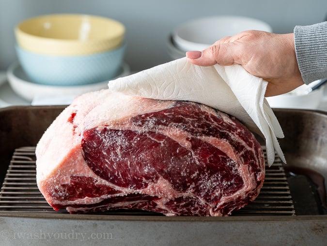 Use paper towels to pat the Prime Rib down and remove excess moisture.