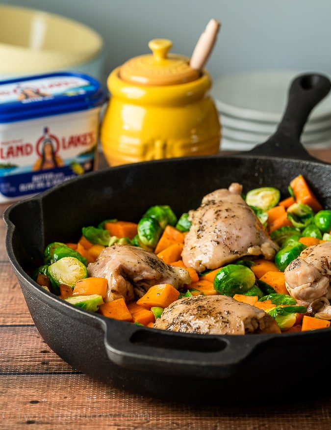 Start by searing the chicken thighs in a large oven-safe skillet.