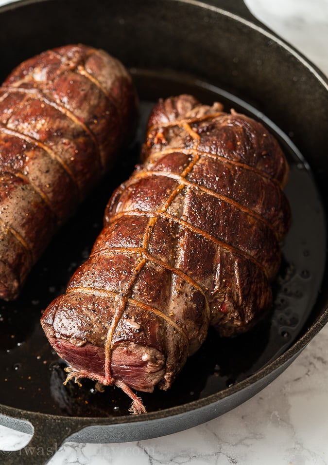 Sear the beef tenderloin in a skillet over medium-high heat.