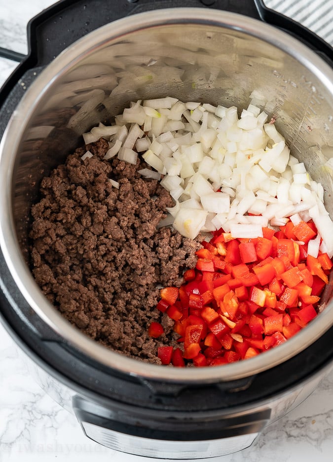 Ground beef, onion and red bell peppers in Instant Pot
