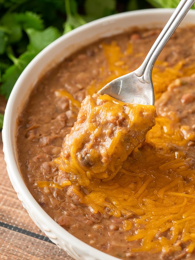 These cheesy Refried Beans are a Mexican staple, made quickly and effortlessly in the Instant Pot.