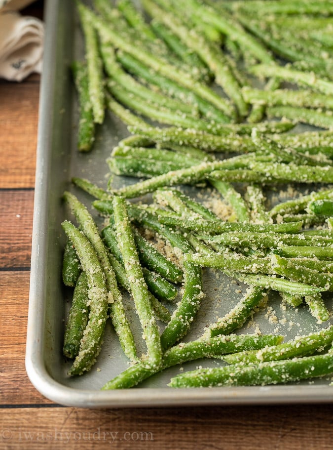 Coat the green beans in parmesan cheese, garlic powder and salt and pepper before roasting