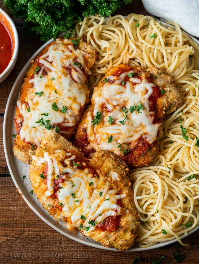 Easy Chicken Parmesan Recipe made in the air fryer and served with fresh cooked pasta