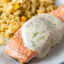 This delightfully easy Baked Salmon Recipe is topped with a creamy dill sauce that'll make you want to lick your plate clean. 