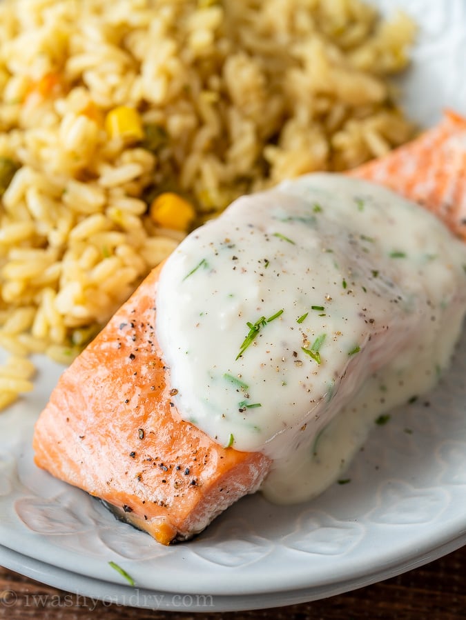 This delightfully easy Baked Salmon Recipe is topped with a creamy dill sauce that'll make you want to lick your plate clean. 