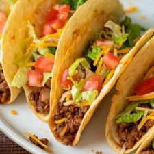 Close up image of Ground Beef Taco with toppings on white plate