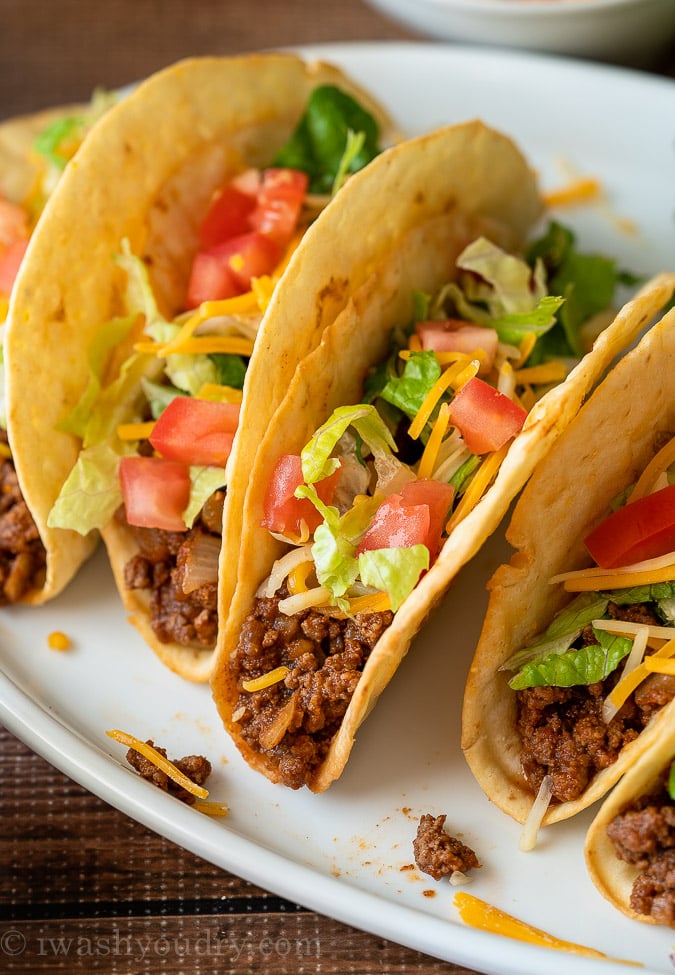 Close up image of Ground Beef Taco with toppings on white plate