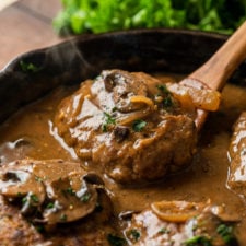 All you need is 30 minutes to whip up this super easy Salisbury Steak Recipe. Filled with seasoned ground beef "steaks" and simmered in a rich mushroom gravy, this dish is best served over creamy mashed potatoes!