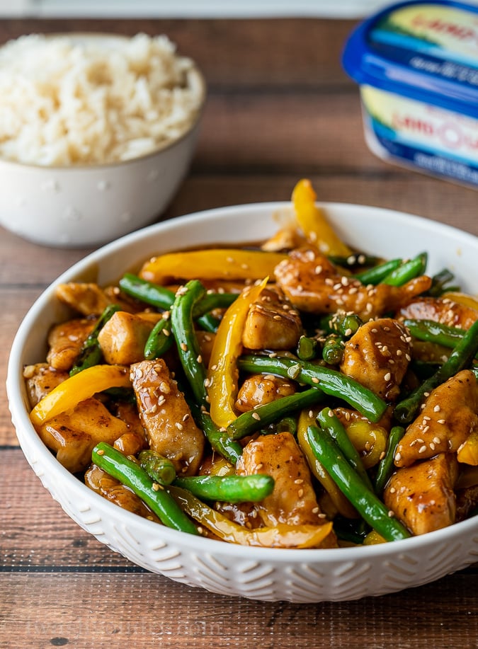 This quick and easy Honey Sesame Chicken Stir Fry is filled with tender chicken breast strips, green beans and yellow peppers in a sweet and sticky sauce.