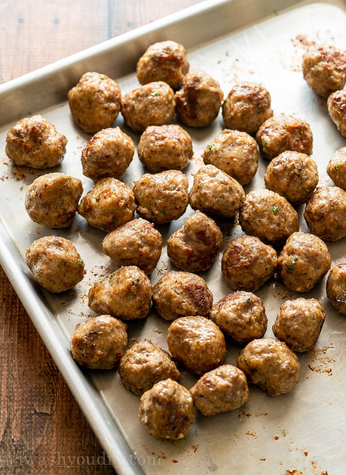 Golden brown meatballs baked in the oven on baking sheet