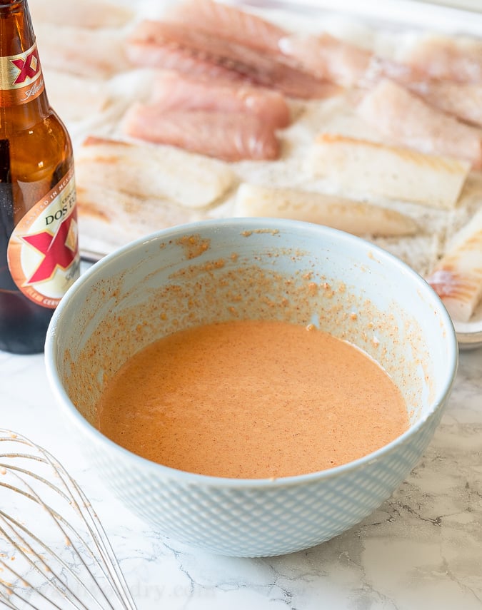 Season each piece of fish with salt and pepper before dipping into the beer batter and frying.