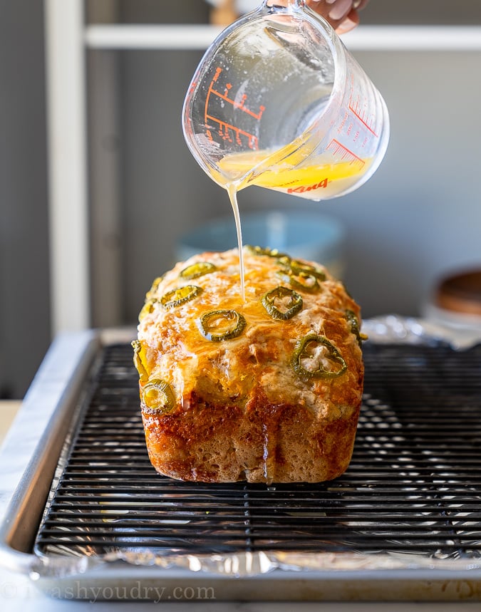 Pour melted butter all over the beer bread right after it's taken out of the oven while it's still nice and hot.