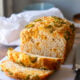 This quick (no yeast required) Cheesy Jalapeño Beer Bread Recipe is soft and tender with the perfect blend of cheddar throughout!