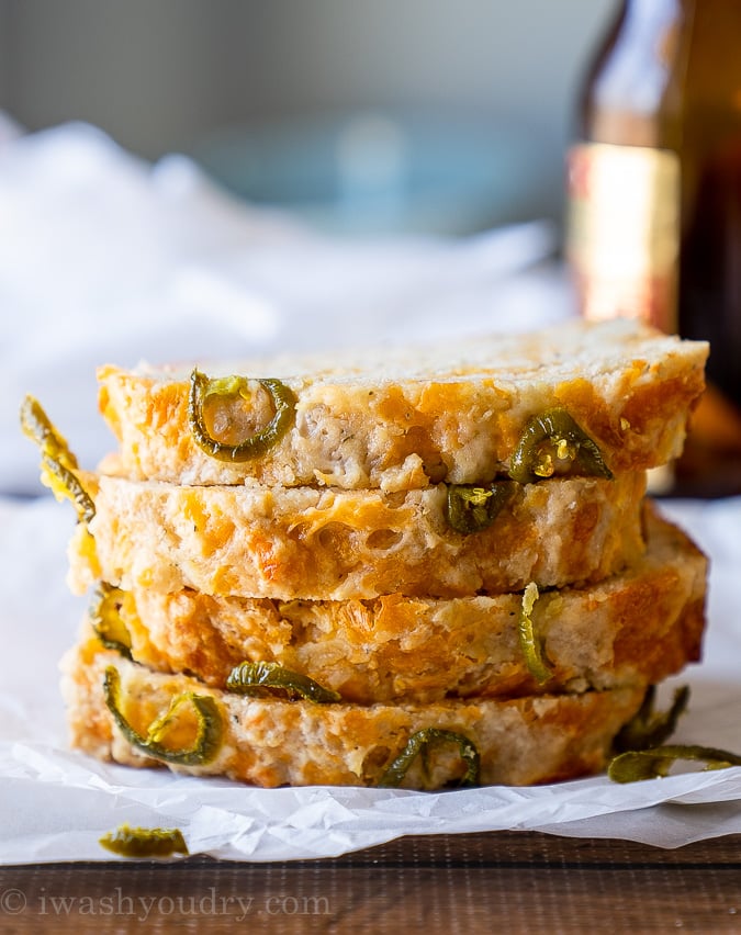 Cheesy Jalapeño Beer Bread sliced and stacked high! Super tender and flavorful bread that's super quick and easy to make!