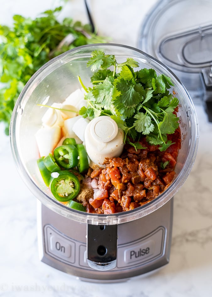 Ingredients needed for restaurant style salsa layered in a food processor