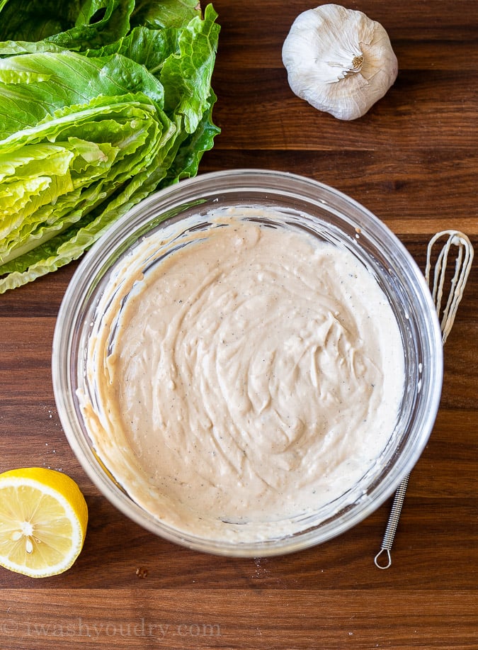 A bowl of whisked up Caesar Salad Dressing