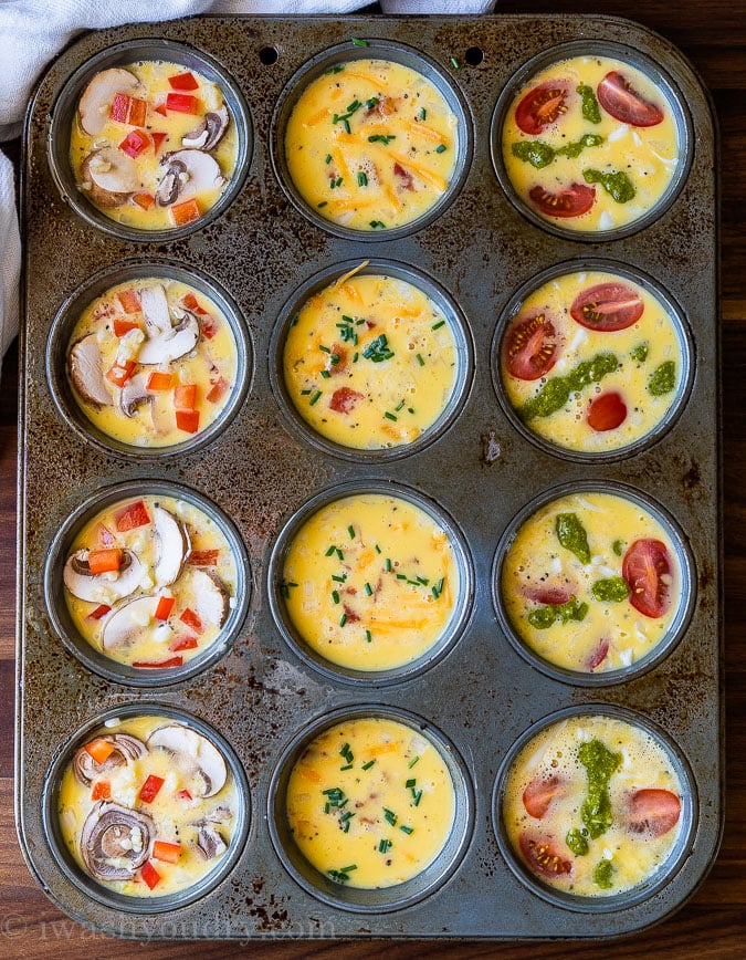 Egg Muffins in a muffin tin with different toppings in each row.