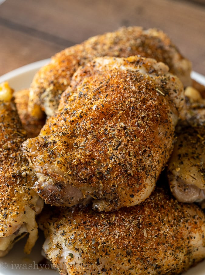 Close up image of oven roasted chicken thighs on a platter.