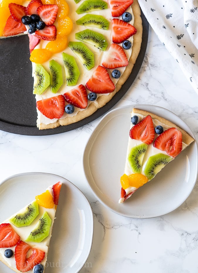 Slices of fruit pizza on plates
