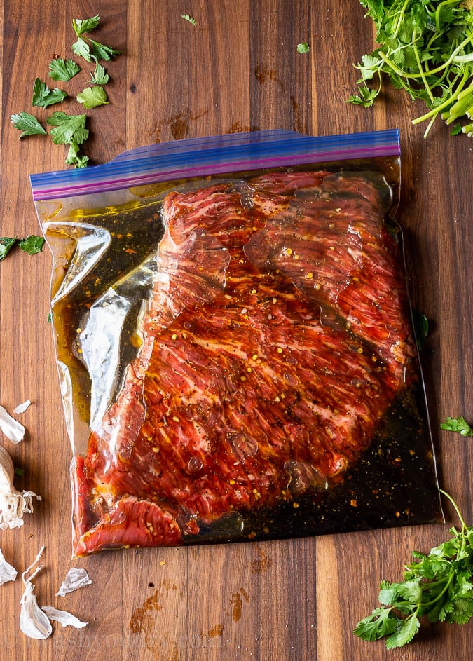 Marinating skirt steak in a zip close bag.