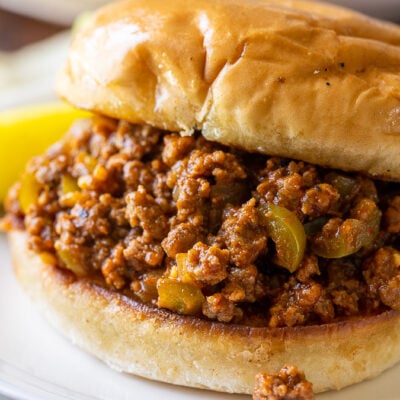Skip the canned stuff, this homemade Easy Sloppy Joe Recipe is by far the BEST! Jam-packed with tender ground beef, peppers and onions in a lightly sweet and smokey sauce on a toasted bun.