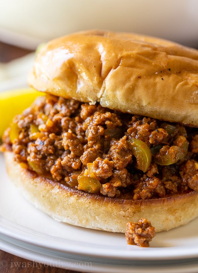 Skip the canned stuff, this homemade Easy Sloppy Joe Recipe is by far the BEST! Jam-packed with tender ground beef, peppers and onions in a lightly sweet and smokey sauce on a toasted bun.