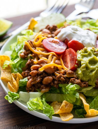 Close up of taco salad on white plate