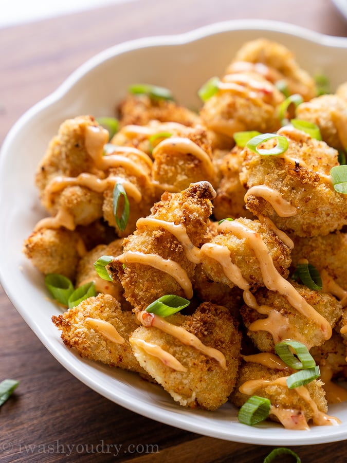 Crispy breaded chicken topped with bang bang sauce and green onions.