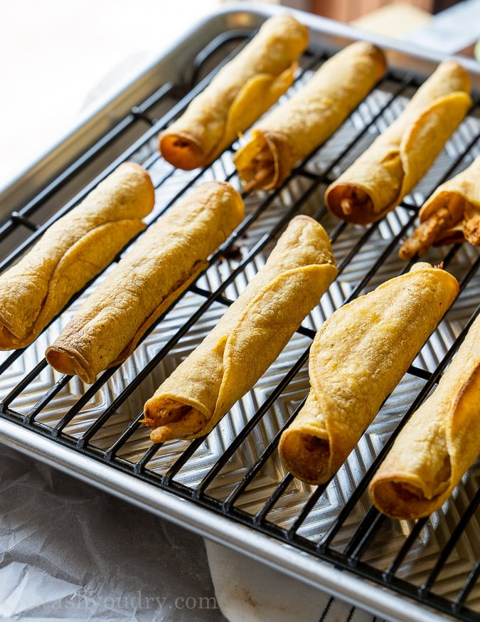 Crispy Baked Chicken Taquitos on a baking sheet