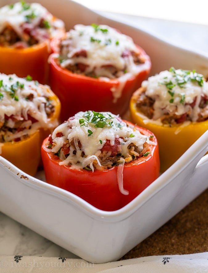 Casserole dish filled with cheesy stuffed peppers.