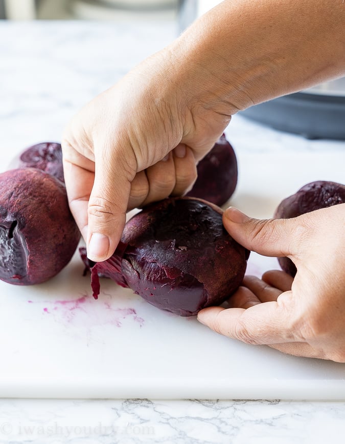 Peeling beets one a cutting board