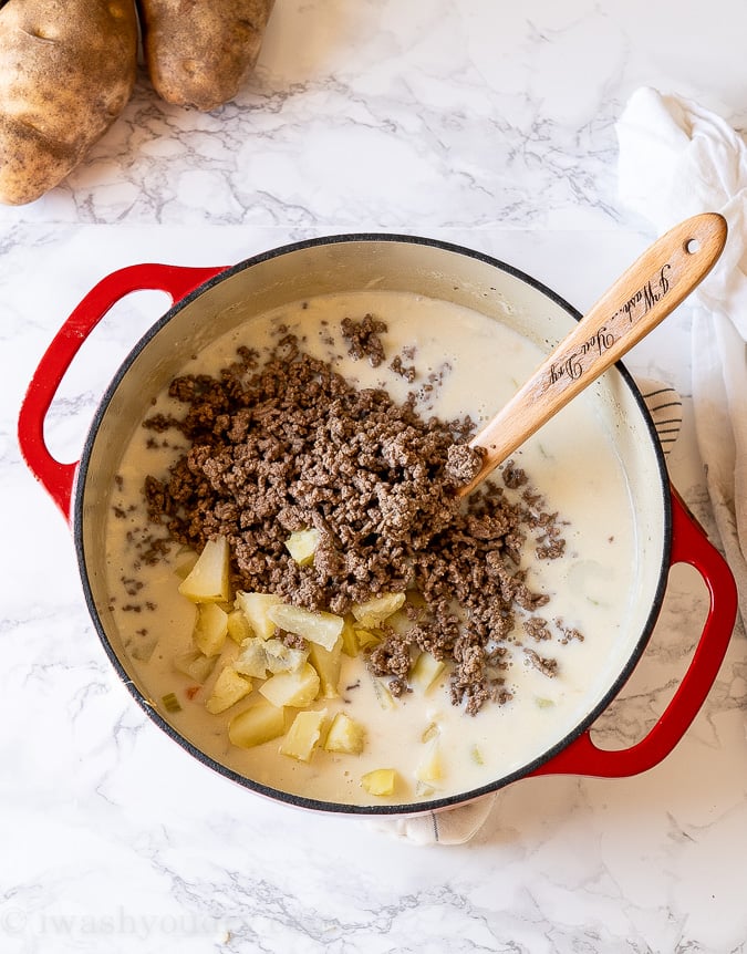 Add the ground beef and potatoes to soup.