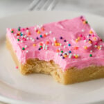 This Easy Sugar Cookie Recipe is topped with sugar cookie icing and sprinkles. Perfect for feeding a crowd!