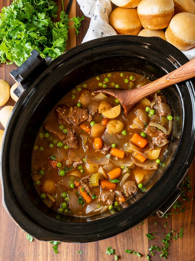 crock pot of stew with potatoes and carrots