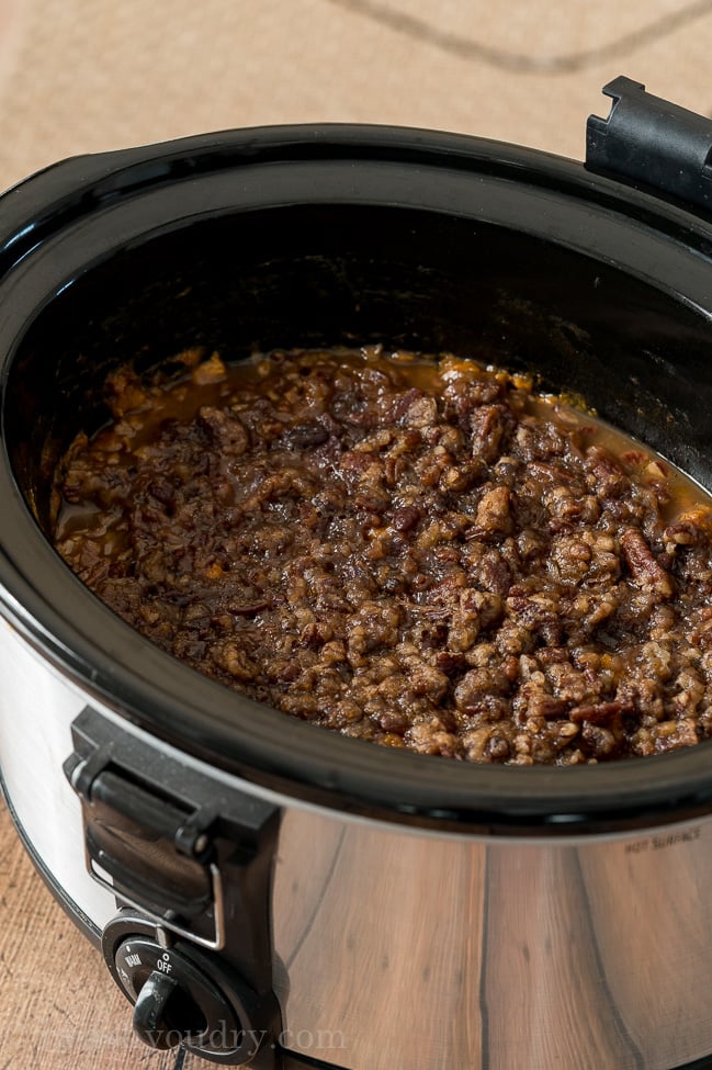 slow cooker sweet potato casserole in crock pot with brown sugar topping.