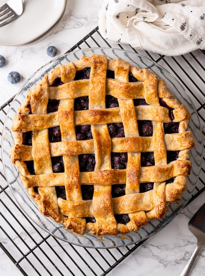 Blueberry pie on a cooling rack