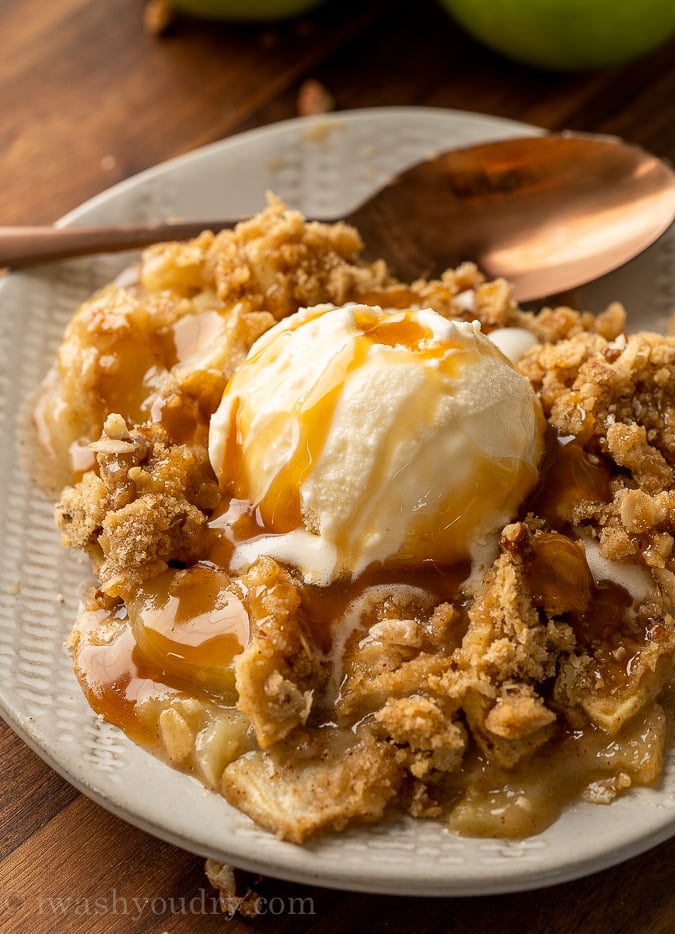 plate with apple crisp and vanilla ice cream