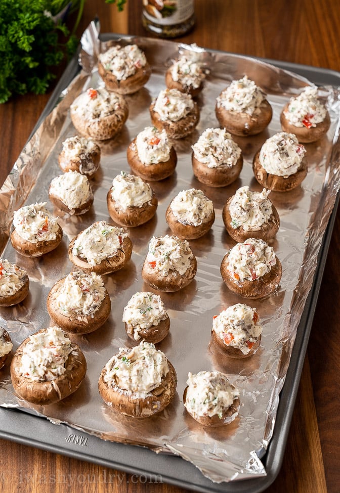 stuffed mushrooms lined up on tray