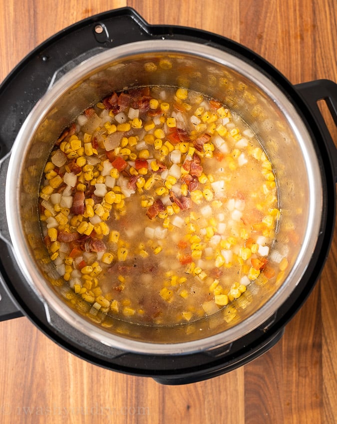 spoonful of corn chowder in bowl