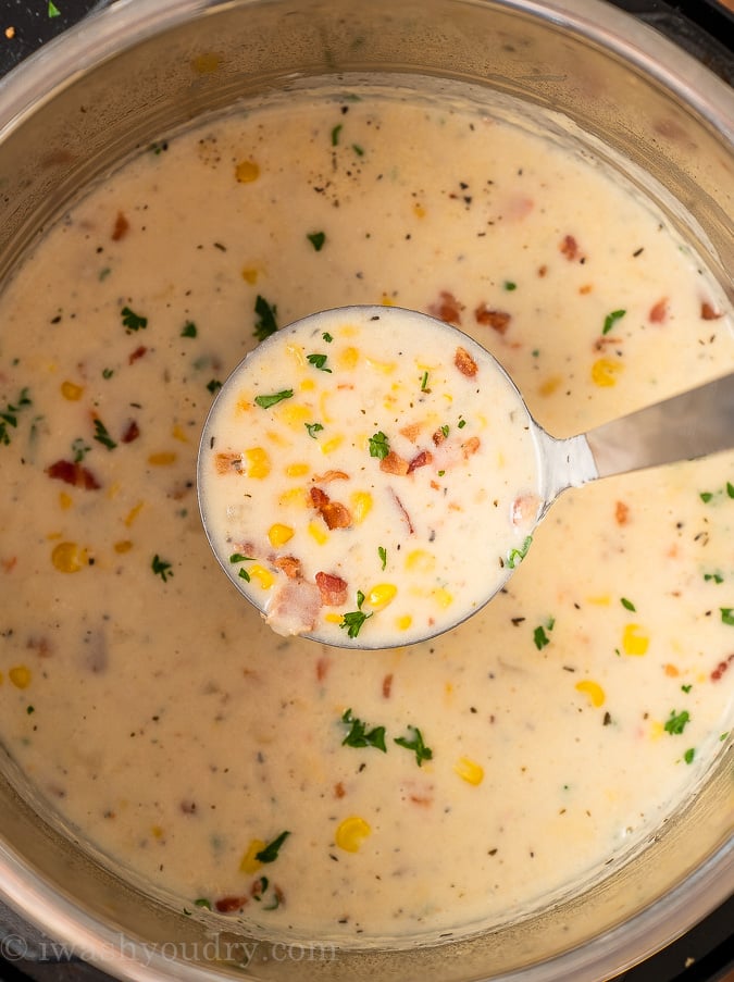 ladle of corn soup in pot