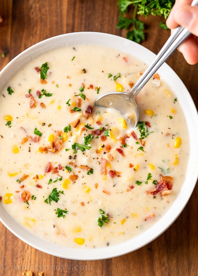 corn chowder in bowl with spoon