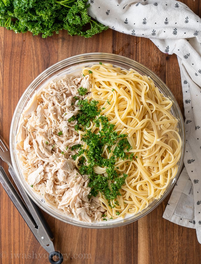 bowl of pasta with chicken and creamy white sauce