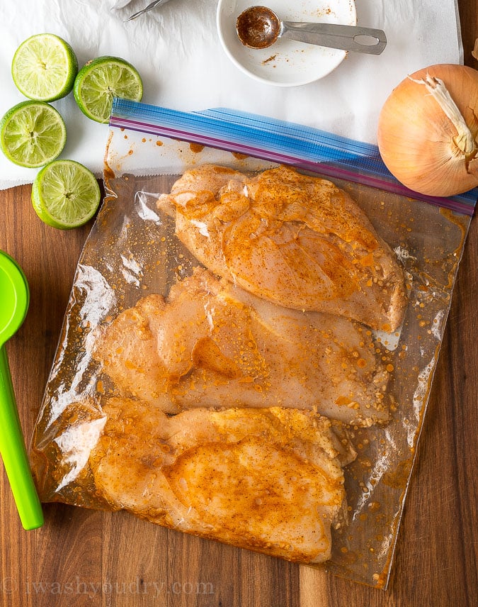 chicken breast marinating in ziplock bag