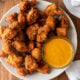 plate with chicken nuggets and dipping sauce