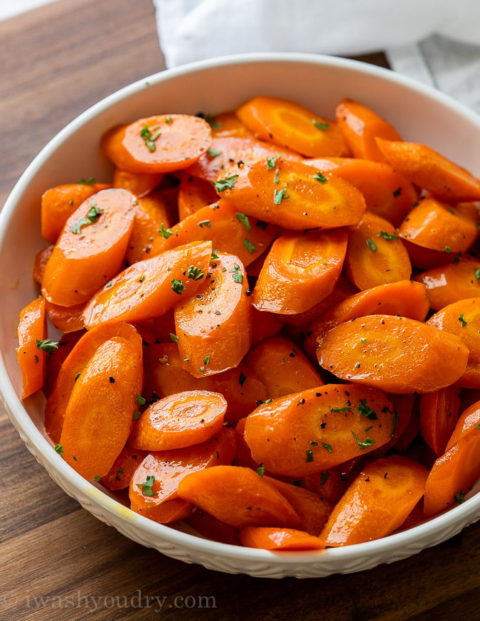 white bowl full of sliced roasted carrots