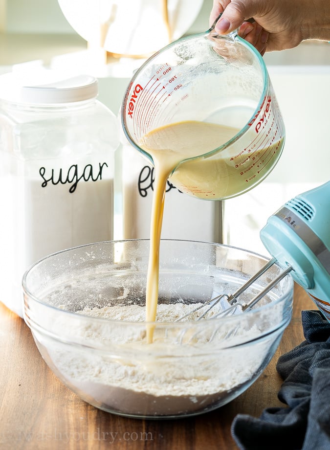 pouring wet ingredients into dry ingredients