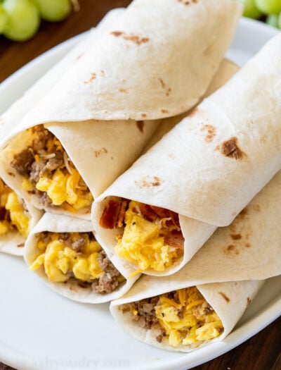 plate of breakfast burritos with bacon and sausage
